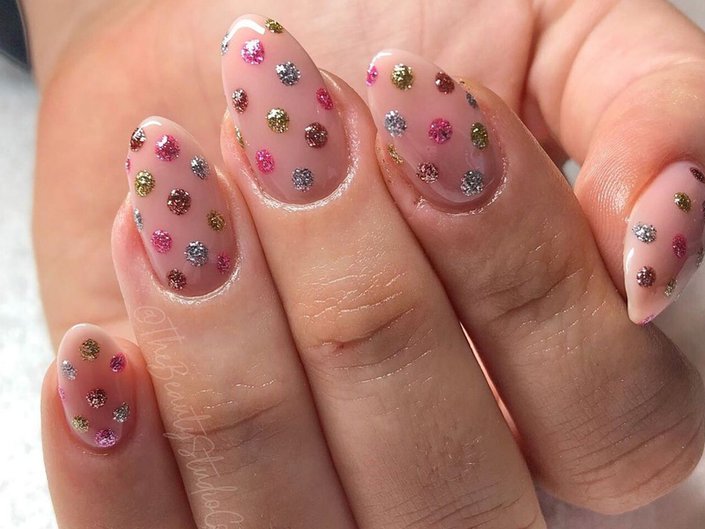 Nails with rainbow sparkly polka dots
