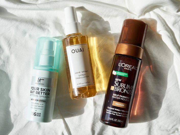 it cosmetics your skin but better setting spray and hydrating mist, ouai wave spray, l'oreal paris sublime bronze self-tanning water mousse