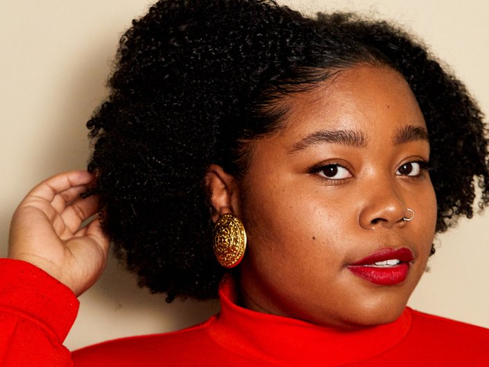 person with dark skin wearing red lipstick