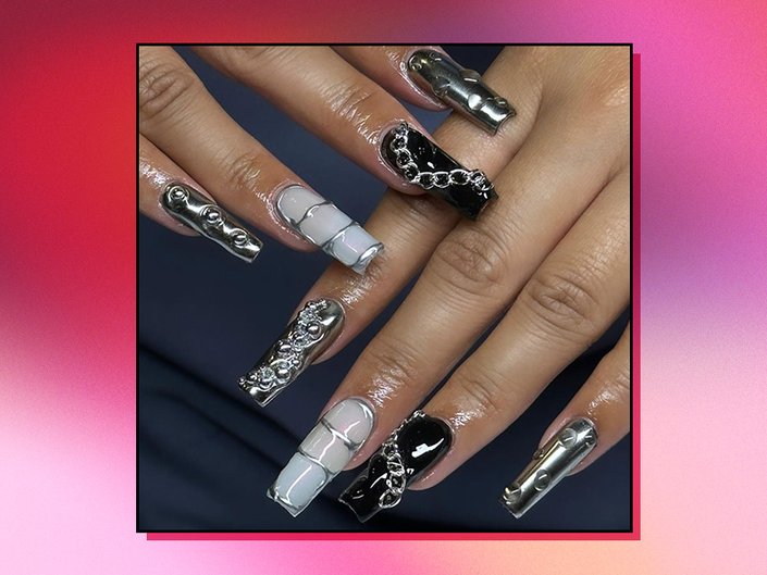 Picture of a mismatched black and silver manicure of red gradient graphic background