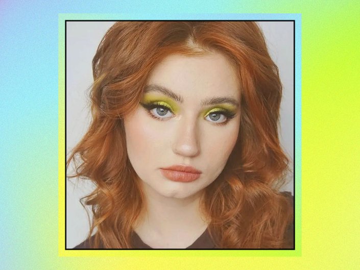 person wearing green eye makeup