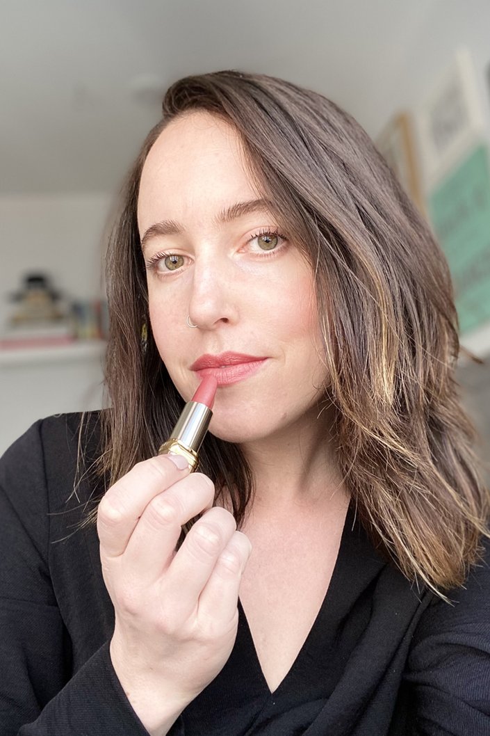 person wearing l'oreal paris les nus colour riche lipstick in nu irreverent