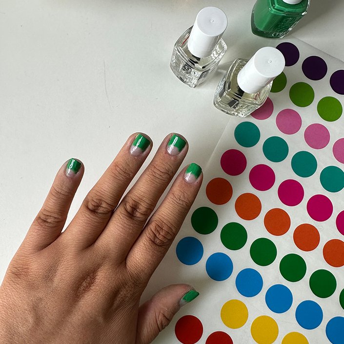 Hand painted with a green half-moon manicure