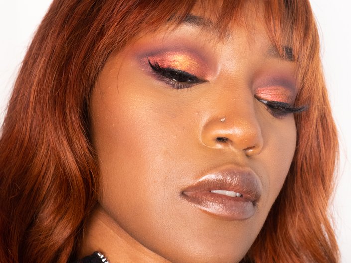 person wearing colorful metallic eyeshadow and metallic lipstick