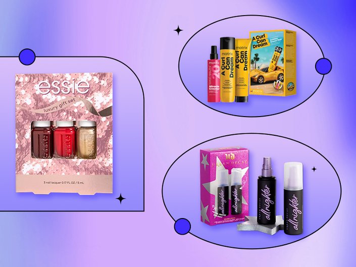 Image of three holiday gift sets on a graphic purple background