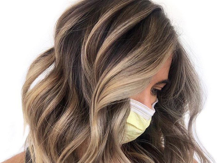 Picture of a person in profile with blonde chunky highlights