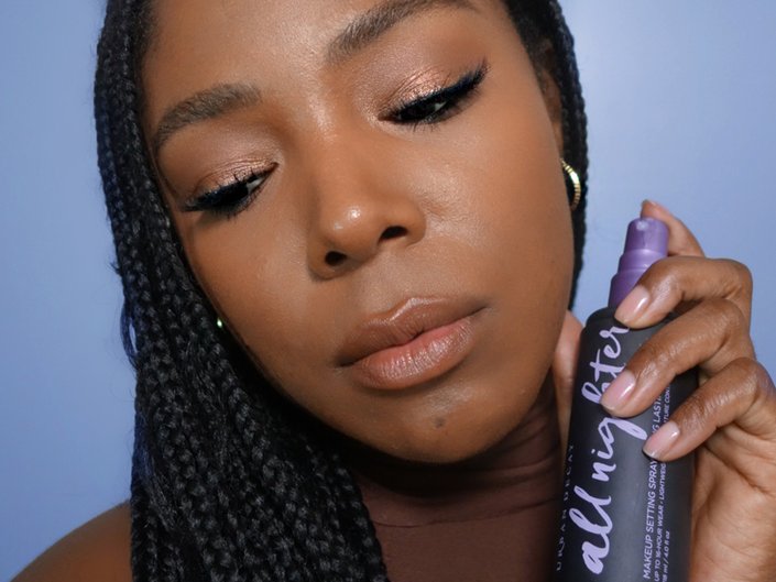 person holding Urban Decay All Nighter Long-Lasting Makeup Setting Spray
