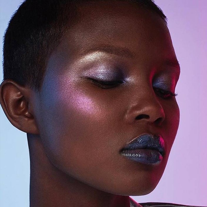 person wearing purple metallic makeup
