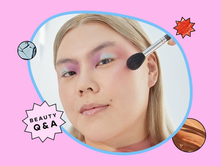 person applying blush to their cheeks