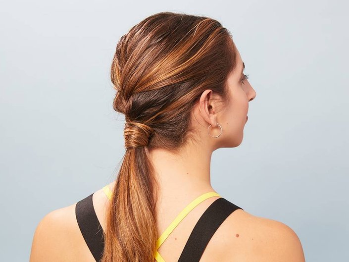 person wearing a french braid ponytail